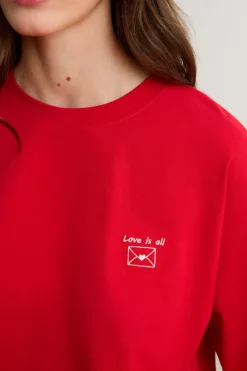 Camiseta de manga corta con la inscripción «love is all» de algodón