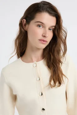 Top de manga larga con botones dorados