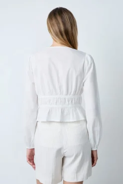 Top de manga larga de algodón con lazos