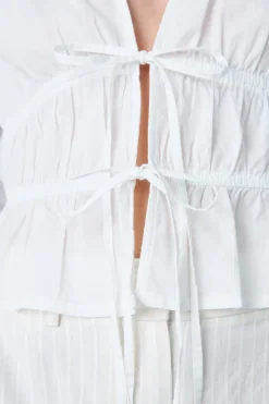 Top de manga larga de algodón con lazos