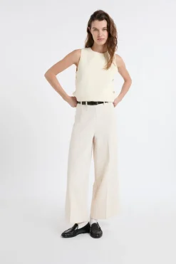 Top sin mangas de algodón con botones dorados